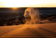 <p>A gust of wind picks up the sand in Queensland.</p>