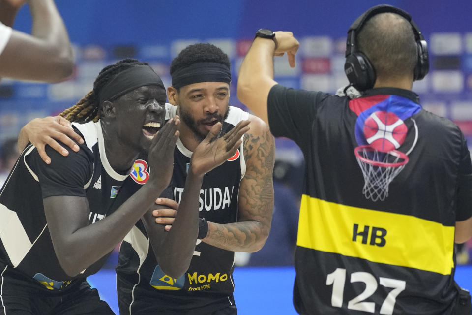 South Sudan team celebrates after winning against Angola during their Basketball World Cup classification match at the Araneta Coliseum, Manila, Philippines on Saturday Sept. 2, 2023. (AP Photo/Aaron Favila)