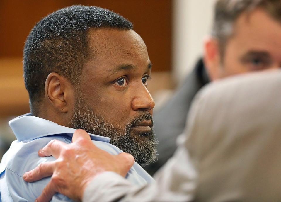 Cornel Bell listens to his attorneys, Neil Madden and John Brinkman, during Bell's murder trial in Norfolk Superior Court in the 2017 killing of Michelle Clark on Wednesday, June 29, 2022.