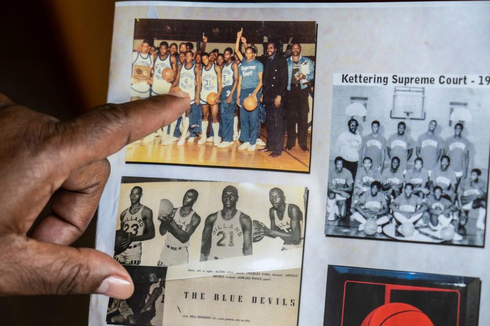 Payne Commercial Service Landscaping Inc. owner Terry Payne points to a picture of himself when he played as point guard for the Kettering High School basketball team in the early 1980s at the headquarters for his business on Detroit's east side on Thursday, June 16, 2022.