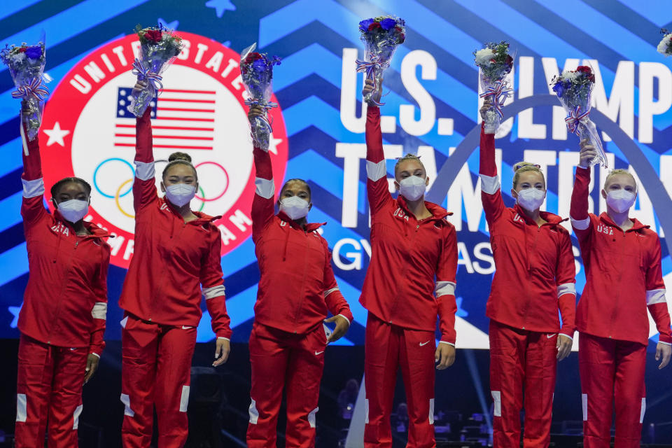 Members of the U.S. Women's Olympic Gymnastic Team, Simone Biles, Suni Lee, Jordan Chiles, and Grace McCallum plus individual members MyKayla Skinner and Jade Carey (L-R) are announced after the U.S. Olympic Gymnastics Trials Sunday, June 27, 2021, in St. Louis. (AP Photo/Jeff Roberson)