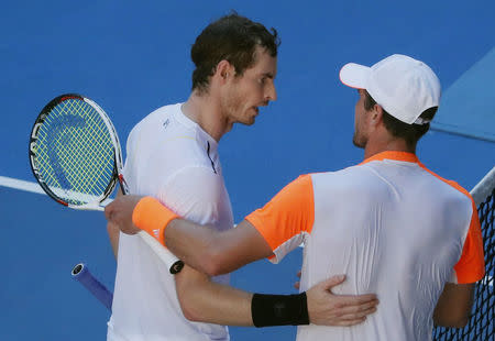 Tennis - Australian Open - Melbourne Park, Melbourne, Australia - 22/1/17 Germany's Mischa Zverev embraces after winning his Men's singles fourth round match against Britain's Andy Murray. REUTERS/Jason Reed