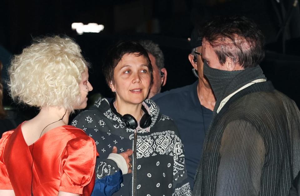 Maggie Gyllenhaal directing Jessie Buckley and Christian Bale. GC Images