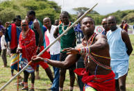 A Maasai Moran from Mbirikani Manyatta, throws a javelin as he competes in the 2018 Maasai Olympics at the Sidai Oleng Wildlife Sanctuary, at the base of Mt. Kilimanjaro, near the Kenya-Tanzania border in Kimana, Kajiado, Kenya December 15, 2018. REUTERS/Thomas Mukoya