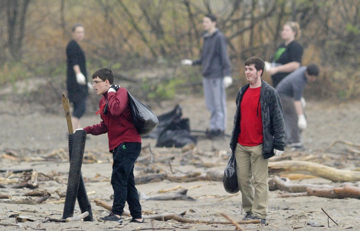 Volunteers help clear plastic and other trash from Presque Isle State Park's Beach 1 during a past cleanup. The 2024 spring cleanup will be April 27.