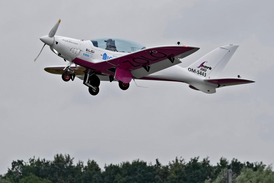 FILE - Belgian-British teenager Zara Rutherford takes off in her Shark ultralight plane at the Kortrijk-Wevelgem airfield in Wevelgem, Belgium, Aug. 18, 2021. Rutherford is set to land in Kortrijk, Belgium on Monday, Jan. 17, 2022, in the hopes of completing her trek around the world as the youngest woman ever, beating the mark of American aviator Shaesta Waiz, who was 30 when she set the previous benchmark. (AP Photo/Virginia Mayo, File)