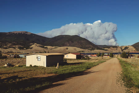 Smoke is seen from a fire in Ute Park, New Mexico, U.S., May 31, 2018 in this picture obtained from social media on June 2, 2018. Reed Weimer/www.reedweimermedia.com/via REUTERS