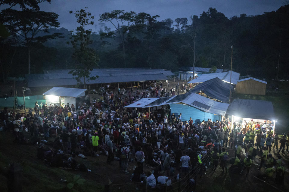 Migrants gather to start the walk across the Darien Gap from Colombia to Panama in hopes of reaching the U.S., at the trailhead camp in Acandi, Colombia, Tuesday, May 9, 2023. Pandemic-related U.S. asylum restrictions, known as Title 42, are to expire Thursday, May 11. (AP Photo/Ivan Valencia)