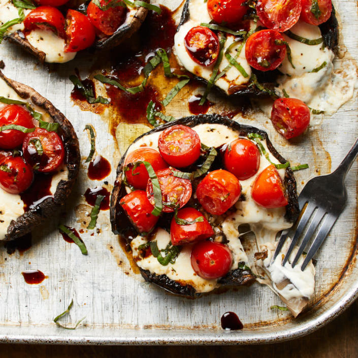 <p>We've taken the key ingredients of the popular caprese salad--tomatoes, fresh mozzarella and basil--and piled them into portobello mushroom caps to make a delicious and satisfying vegetarian main dish. <a href="https://www.eatingwell.com/recipe/265847/caprese-stuffed-portobello-mushrooms/" rel="nofollow noopener" target="_blank" data-ylk="slk:View Recipe" class="link ">View Recipe</a></p>