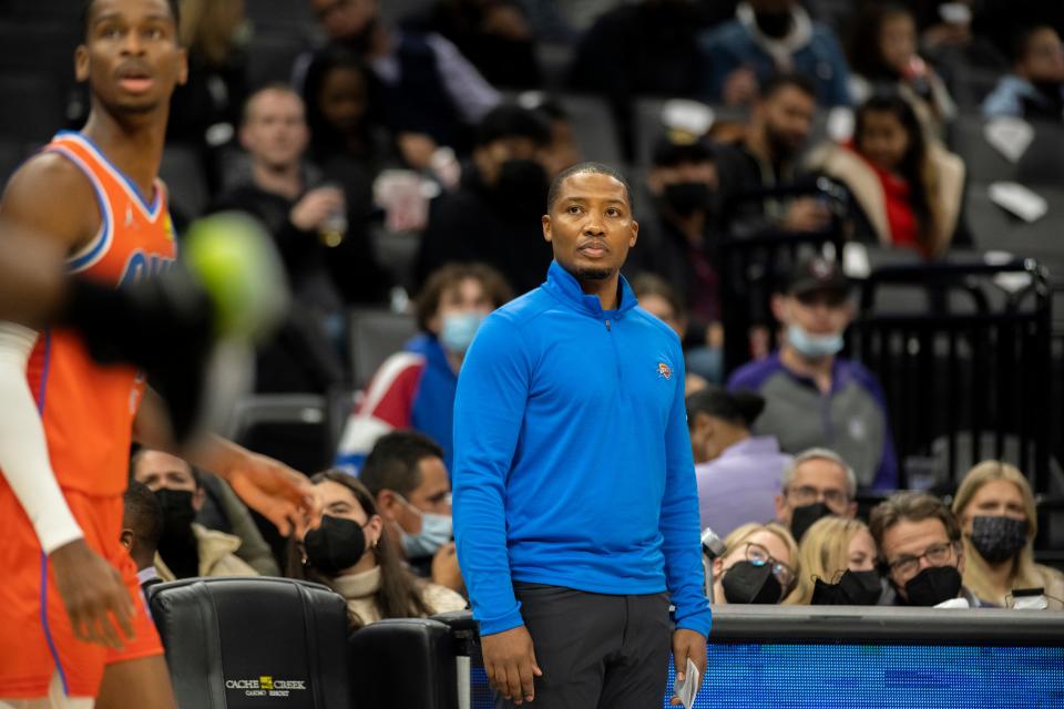 Mike Wilks, acting coach of the Thunder, watches during the first quarter of the Kings' 117-111 win Tuesday in Sacramento, Calif.