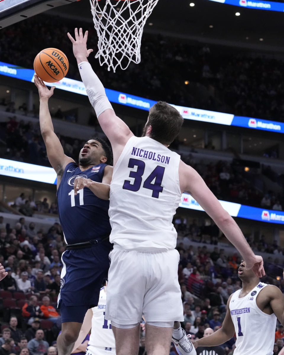 Penn State's Camren Wynter (11) shoots as Northwestern's Matthew Nicholson defends during the first half of an NCAA college basketball game at the Big Ten men's tournament, Friday, March 10, 2023, in Chicago. (AP Photo/Charles Rex Arbogast)