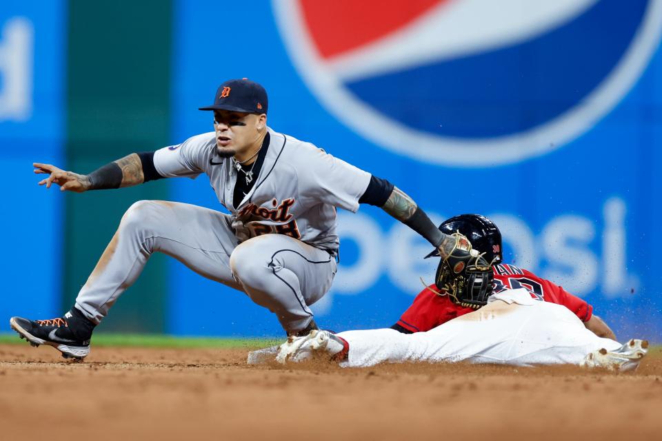 Tigers shortstop Javier Baez tags out Guardians left fielder Steven Kwan attempting to steal second base during the seventh inning on Tuesday, Aug. 16, 2022, in Cleveland.