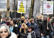 Demonstrators march during a protest against coronavirus measures in Brussels, Belgium, Sunday, Dec. 5, 2021. Hundreds of people marched through central Brussels on Sunday to protest tightened COVID-19 restrictions imposed by the Belgian government to counter the latest spike in coronavirus cases. (AP Photo/Geert Vanden Wijngaert)