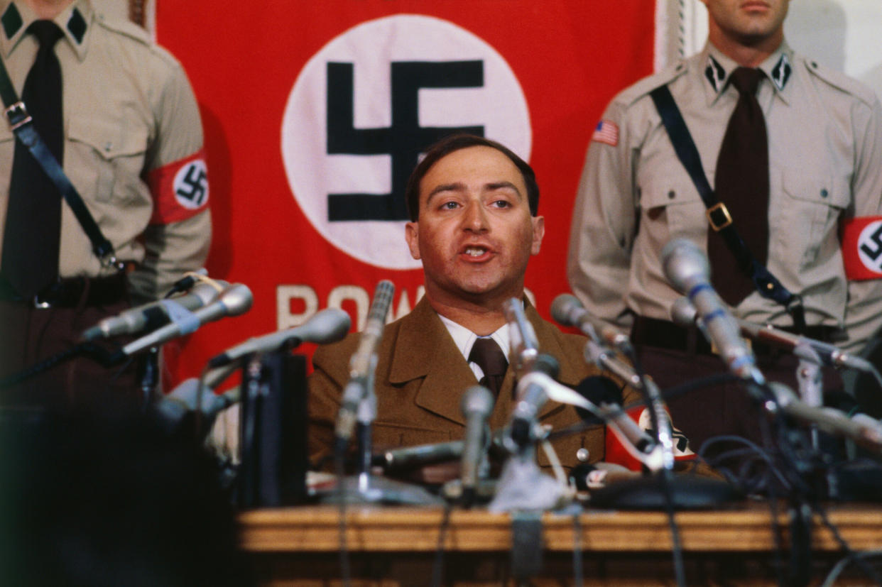 The American Civil Liberties Union defended in 1978 the right of the American Nazi Party to march and assemble in Skokie, Illinois, then home to many Holocaust survivors. Pictured here is Nazi leader Frank Collin addressing a press conference. (Credit: Getty Images)