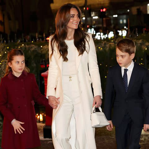 <p>Chris Jackson/Getty</p> Princess Charlotte, Kate Middleton and Prince George at the carol concert on Dec. 8