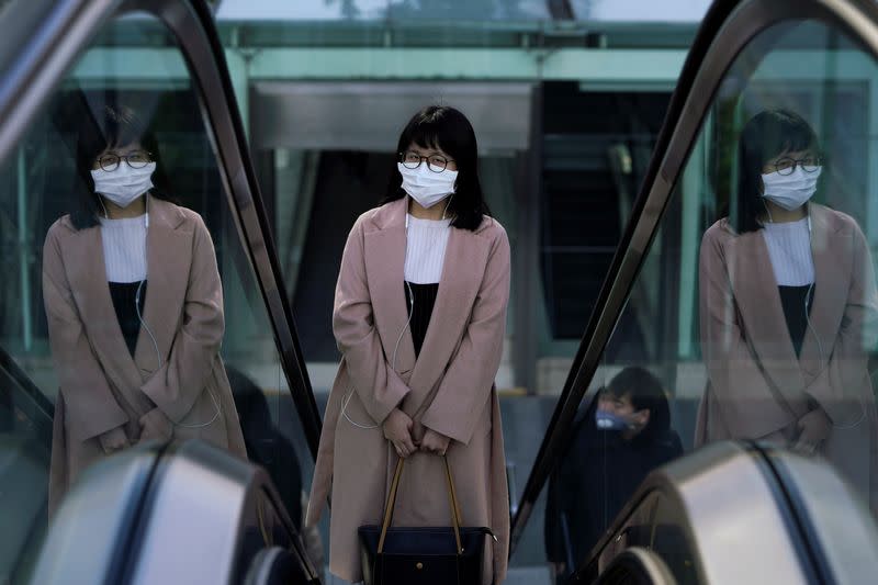 A woman wearing a mask is seen as the country is hit by an outbreak of the novel coronavirus in Shanghai