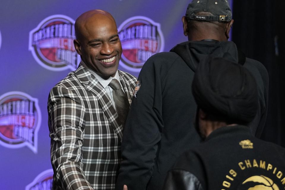 Vince Carter greets guest before the Basketball Hall of Fame news conference Friday, Feb. 16, 2024, in Indianapolis. (AP Photo/Darron Cummings)