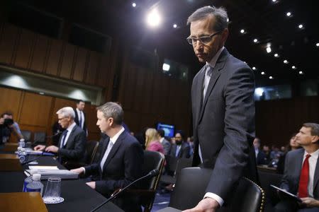 (L-R) Colin Stretch, general counsel for Facebook; Sean Edgett, acting general counsel for Twitter; and Richard Salgado, director of law enforcement and information security at Google, arrive to testify before Senate Judiciary Crime and Terrorism Subcommittee hearing on on "ways to combat and reduce the amount of Russian propaganda and extremist content online," on Capitol Hill in Washington, U.S., October 31, 2017. REUTERS/Jonathan Ernst