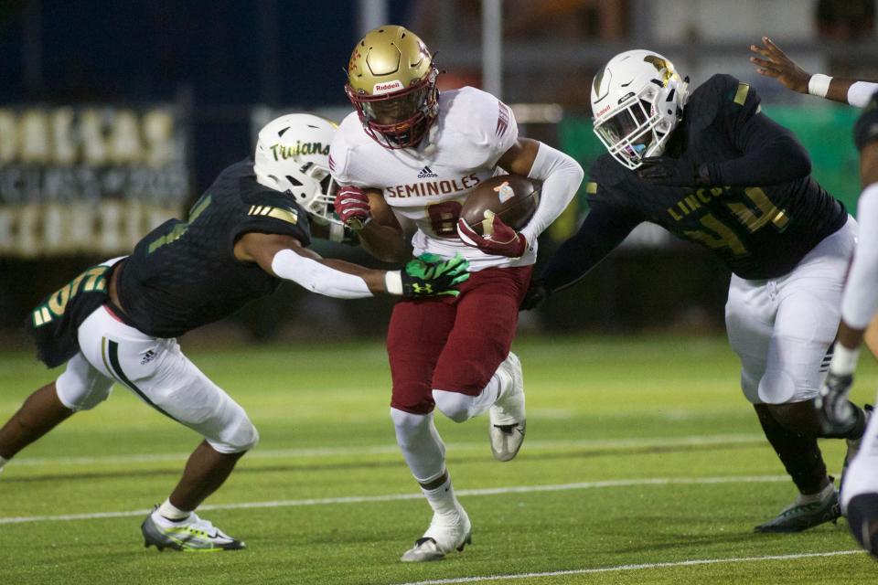 Florida High junior Micah Danzy (8) returns a punt in a game against Lincoln on Nov. 3, 2022, at Gene Cox Stadium. The Seminoles won, 10-9.