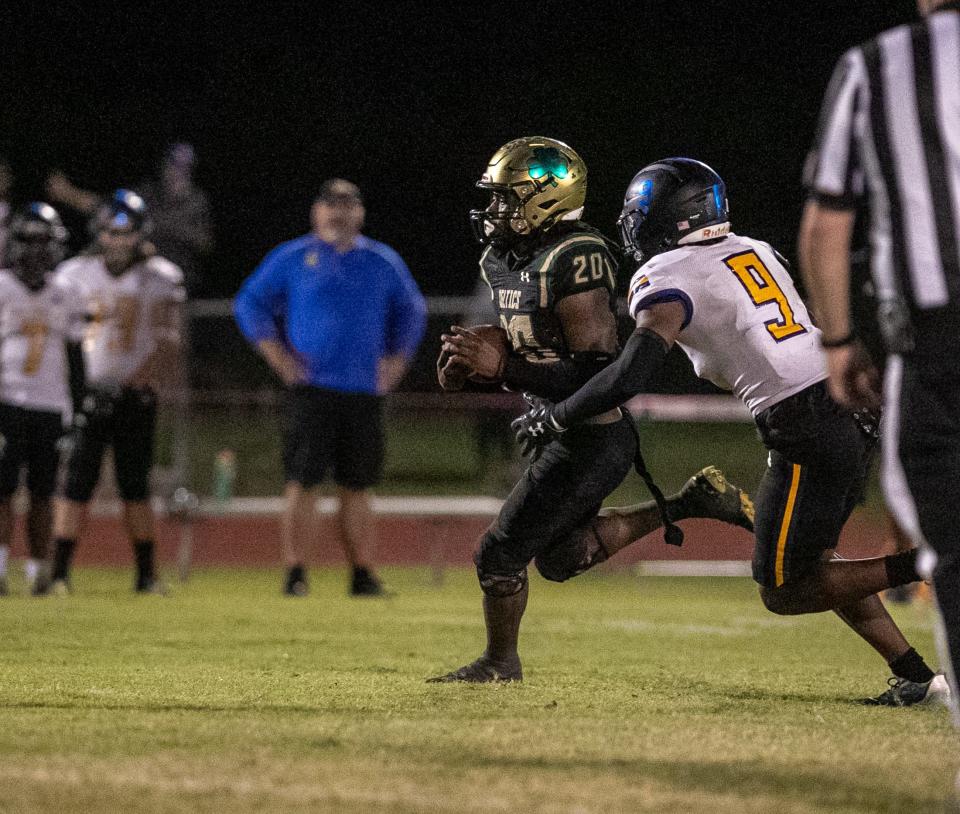 Trinity Catholic Celtic's Beau Beard (20) carries the ball for a first down in the first half against John Carroll at Trinity Catholic in Ocala, FL on Friday, December 2, 2022. [Cyndi Chambers/Ocala Star Banner] 2022