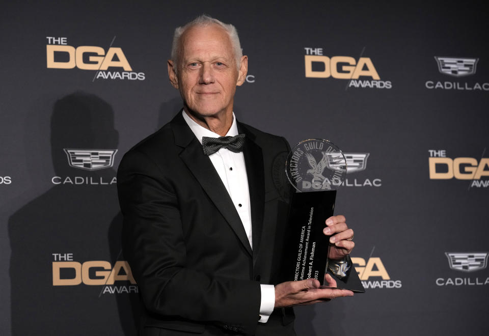 Robert A. Fishman poses in the press room with the lifetime achievement award at the 75th annual Directors Guild of America Awards on Saturday, Feb. 18, 2023, at the Beverly Hilton hotel in Beverly Hills, Calif. (AP Photo/Chris Pizzello)