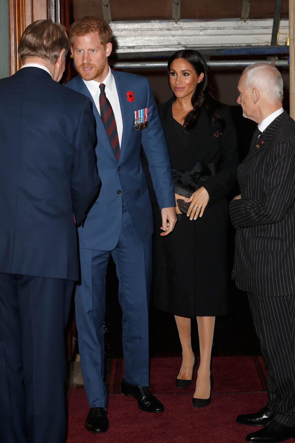 Harry and Meghan arrive at the Royal Albert Hall, where she is seen wearing nude tights (Getty)