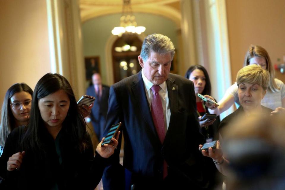 Senator Joe Manchin, Democrat of West Virginia, speaks to reporters before attending a meeting on infrastructure on Capitol Hill.