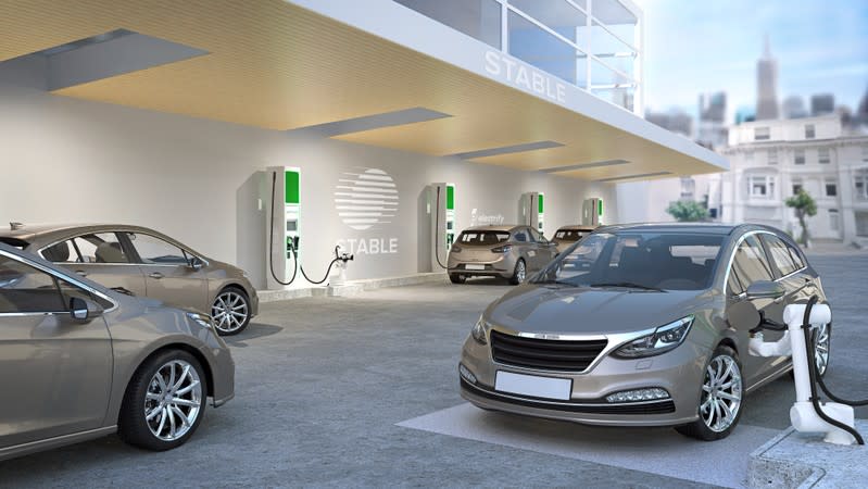 Future charging facility for autonomous vehicles using Stable robotics and Electrify America chargers is seen in an artist's rendering