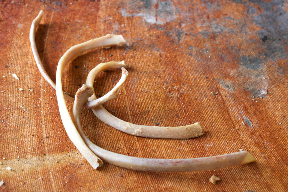 Human bones on a table in the abandoned morgue.