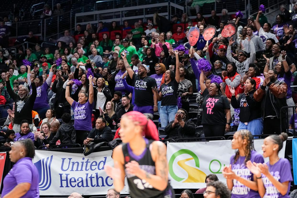 Africentric fans cheer during the girls basketball team's 55-37 win over Wheelersburg in a 2023 Division III state semifinal at University of Dayton Arena.