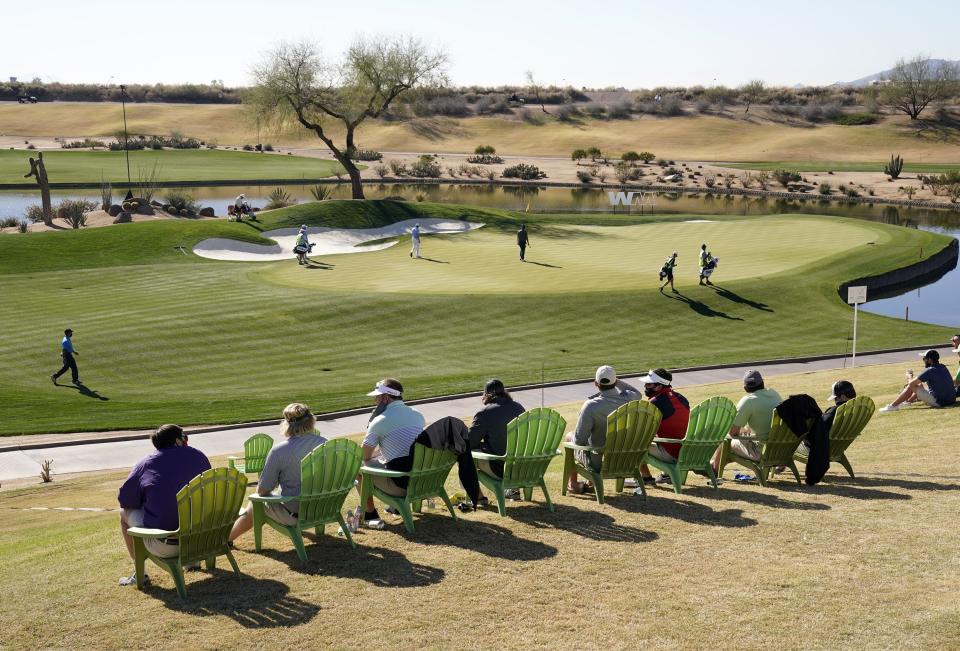 Spectators watch the action at the 12th hole during round three of the Waste Management Phoenix Open at TPC Scottsdale.