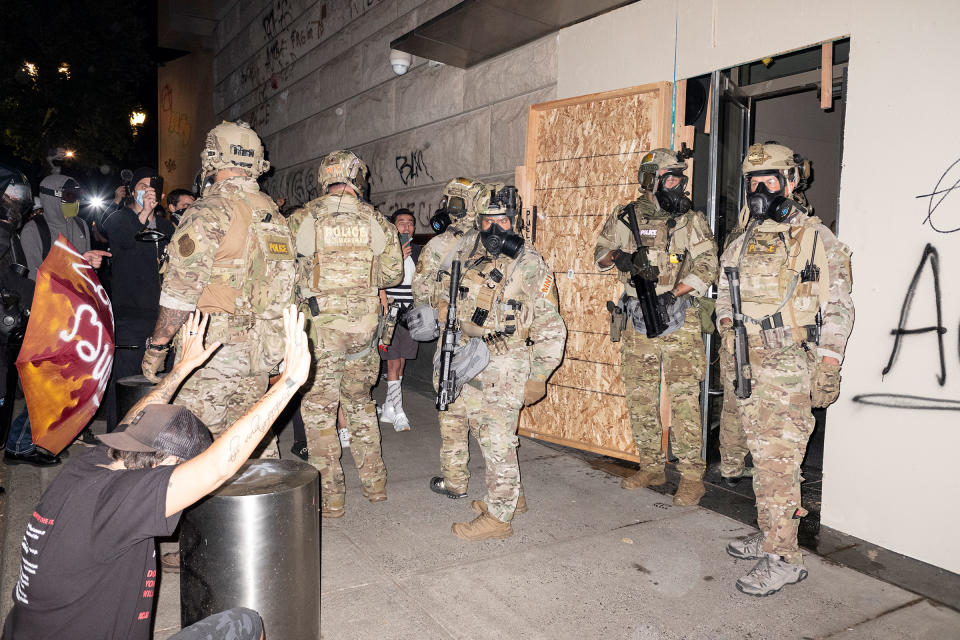 U.S. Marshals outside the Mark O. Hatfield federal courthouse, after making arrests at a Black Lives Matter demonstration in Portland, Ore., on July 10, 2020.<span class="copyright">Rian Dundon</span>