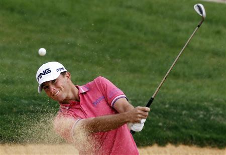Luke Guthrie of U.S. hits out of a sand trap on the 7th hole during the BMW Masters 2013 golf tournament at Lake Malaren Golf Club in Shanghai October 25, 2013. REUTERS/Carlos Barria
