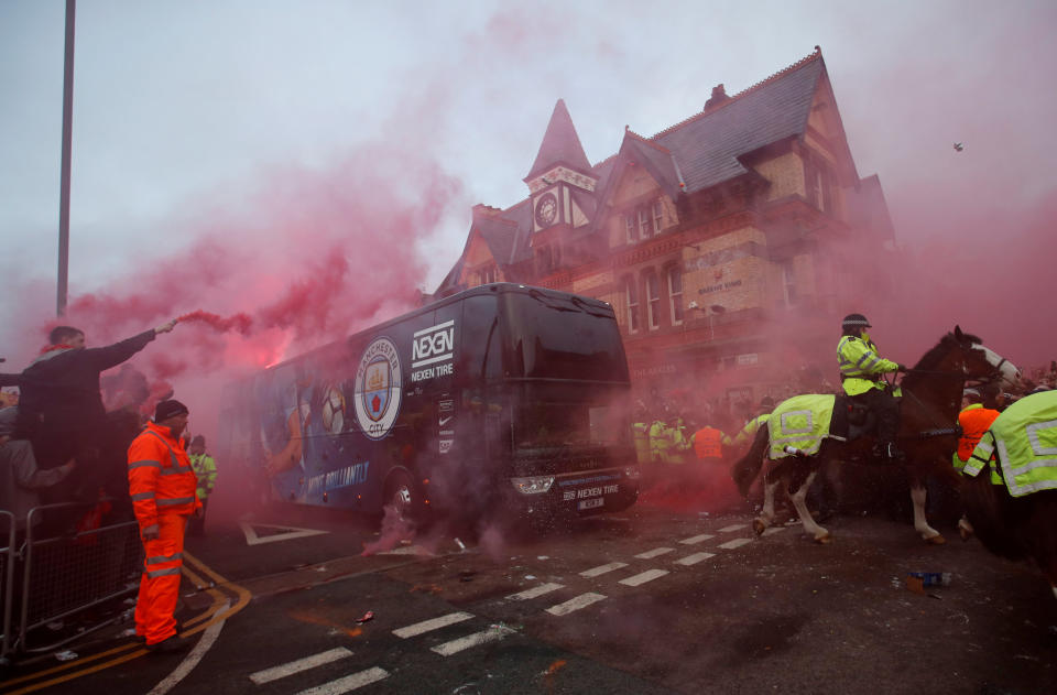 <p>Soccer Football – Champions League Quarter Final First Leg – Liverpool vs Manchester City – Anfield, Liverpool, Britain – April 4, 2018 Liverpool fans set off flares and throw missiles at the Manchester City team bus outside the stadium before the match Action Images via Reuters/Carl Recine </p>