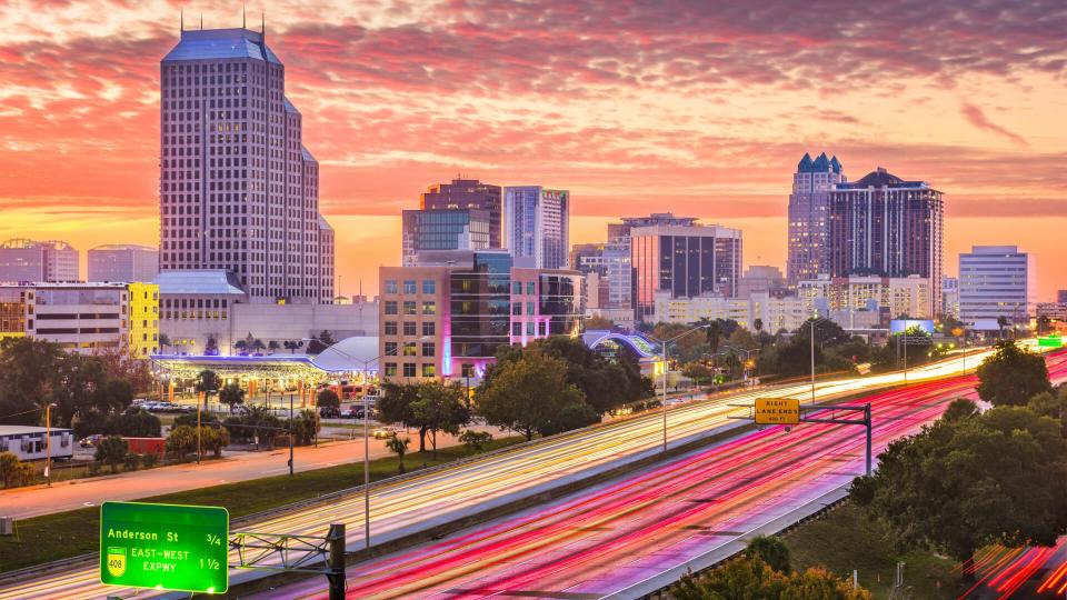 Orlando, Florida, USA downtown cityscape over the highway.