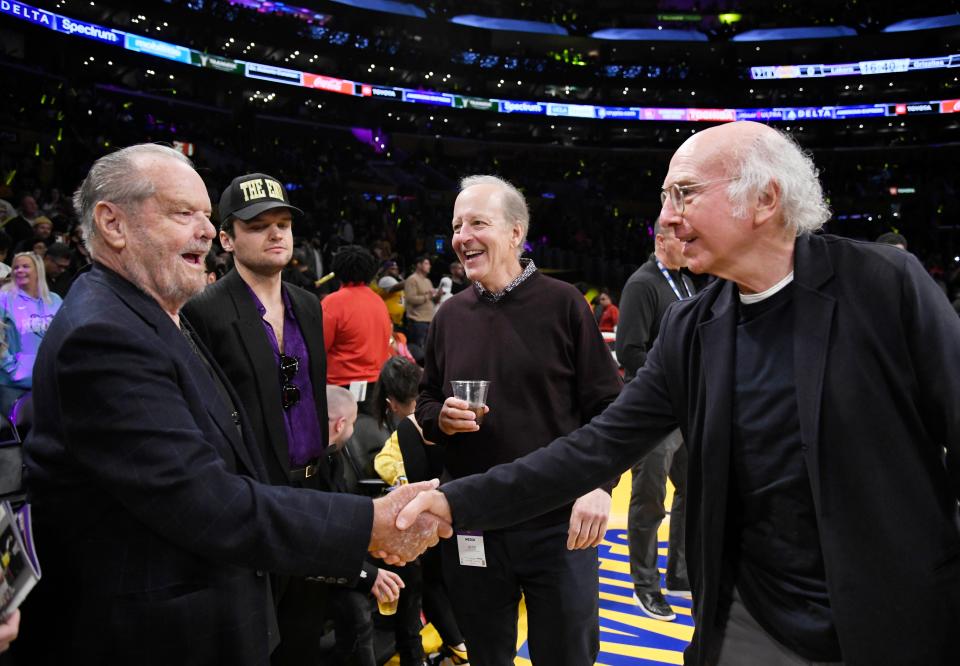 Jack Nicholson greets Larry David as they attend the basketball game between the Los Angeles Lakers and the Memphis Grizzlies on April 28, 2023, in Los Angeles, California.