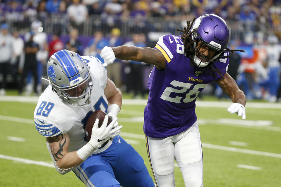 Detroit Lions tight end Isaac Nauta (89) is tackled by Minnesota Vikings cornerback Trae Waynes (26) after catching a pass during the second half of an NFL football game, Sunday, Dec. 8, 2019, in Minneapolis. (AP Photo/Bruce Kluckhohn)