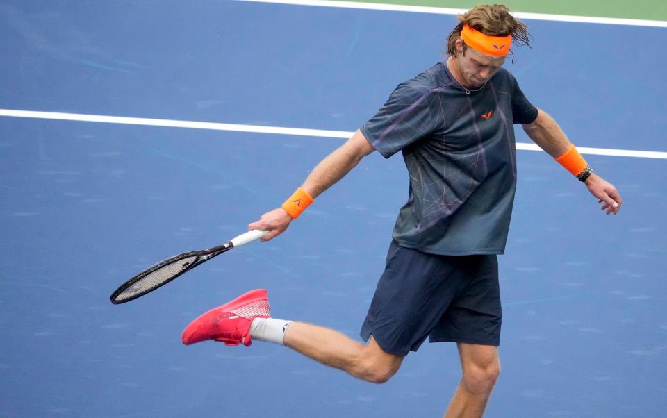 Rublev kicks a ball away in a show of frustratioin