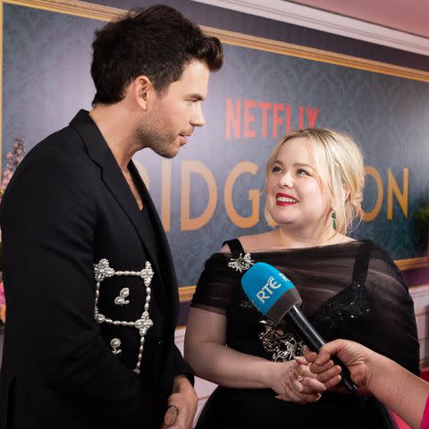 <p>StillMoving.Net/Shutterstock</p> Luke Newton (left) and Nicola Coughlan at a special screening of <em>Bridgerton</em> season 3, part 2 in Dublin, Ireland, on June 4