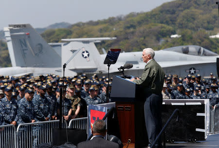 U.S. Vice President Mike Pence delivers a speech to U.S. and Japanese service members on the flight deck of the USS Ronald Reagan, a Nimitz-class nuclear-powered super carrier, at the U.S. naval base in Yokosuka, south of Tokyo, Japan April 19, 2017. REUTERS/Kim Kyung-Hoon