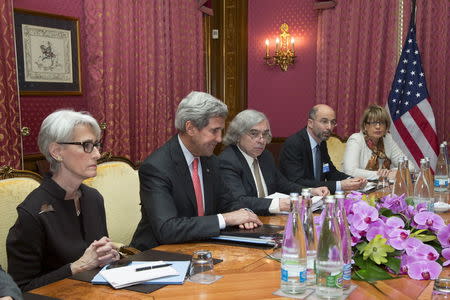 U.S. Secretary of State John Kerry (2nd L) sits at the negotiating table with U.S. Under Secretary for Political Affairs Wendy Sherman (L), U.S. Secretary of Energy Ernest Moniz (C), Robert Malley (2nd R) from the U.S. National Security Council and European Union Political Director Helga Schmid (R) for a meeting with Iran's Foreign Minister Javad Zarif (not pictured) over Iran's nuclear program in Lausanne March 20, 2015. REUTERS/Brian Snyder