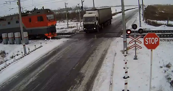 Lorry driver killed in horrific crash with two trains (video)