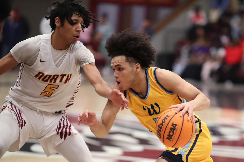 PC West's Chiante' Tramble tries to get past PC North's CJ Smith during a boys high school basketball game between Putnam City North and Putnam City West at PC North High School in Oklahoma City, Friday, Feb. 10, 2023. 