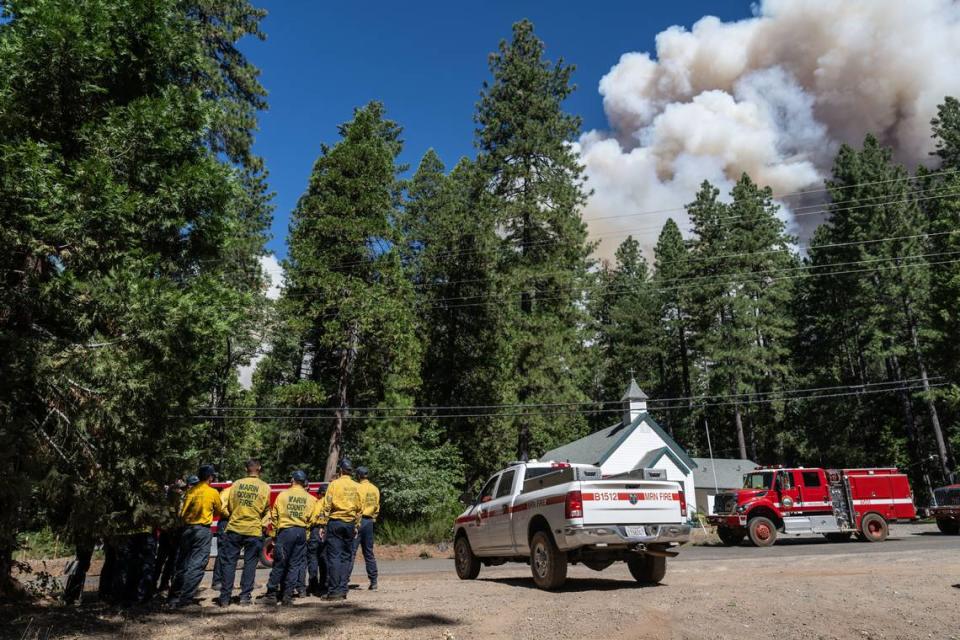 A Cal Fire crew prepares to respond to the Park Fire near the Neighborhood Church of Cohasset on Thursday, July 25, 2024, after the community was evacuated.