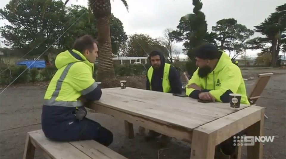 Omar, Oz and Foreman Dan sit down at a bench to chat