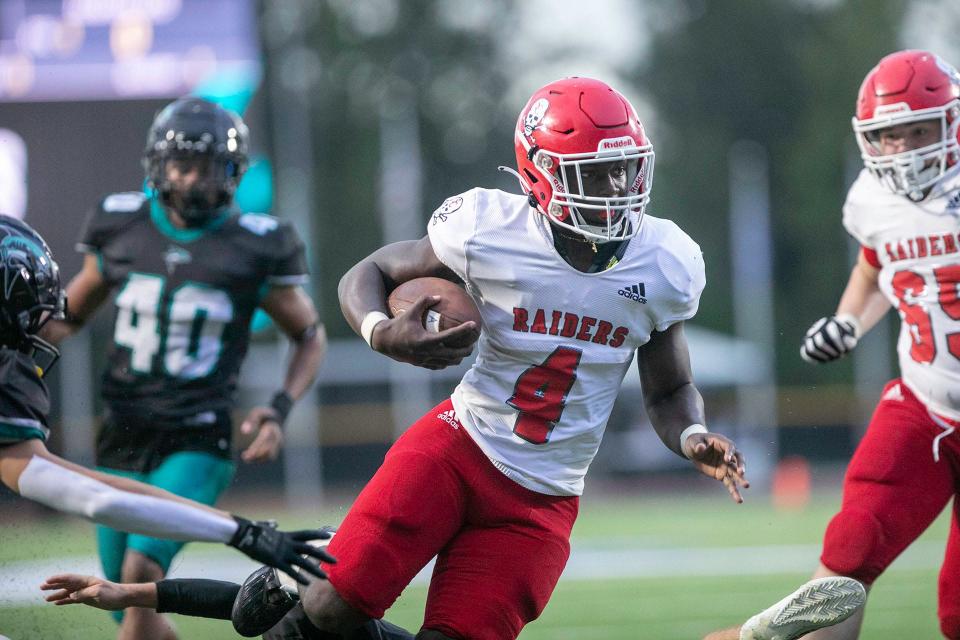 Savannah Christian's Zo Smalls runs past an Islands HIgh defender to score during their game.