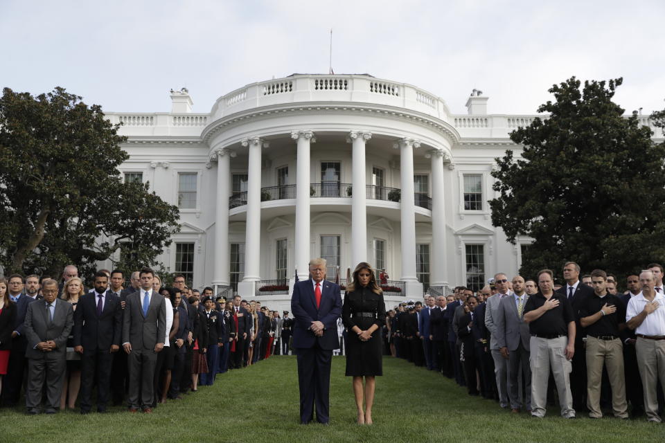 President Donald Trump and first lady Melania Trump participate in a moment of silence honoring the victims of the Sept. 11 terrorist attacks, on the South Lawn of the White House, Wednesday, Sept. 11, 2019, in Washington. (AP Photo/Evan Vucci)