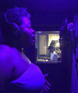 This undated image shows Rashida Bryant singing at a home recording studio in Long Island, N.Y. Bryant, 44, is an Atlanta-based voice instructor through Wyzant, an online marketplace for private tutors, who saw her client roster double from April to June, when she had 30 students. Her students range in age from early teenagers to people in their late 60s. (Kiki Bryant via AP)
