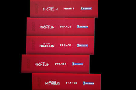 Logos of the new 2017 annual Michelin restaurant guide are seen during the announcement of the newly-promoted chef in Paris, France, February 9, 2017. REUTERS/Benoit Tessier