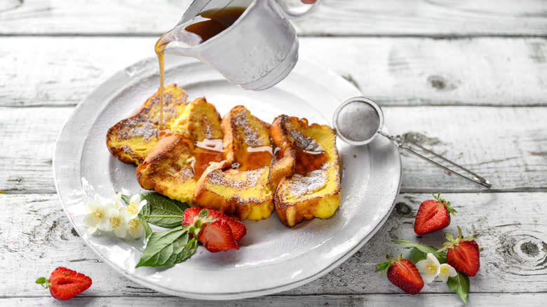 Syrup pouring over French toast